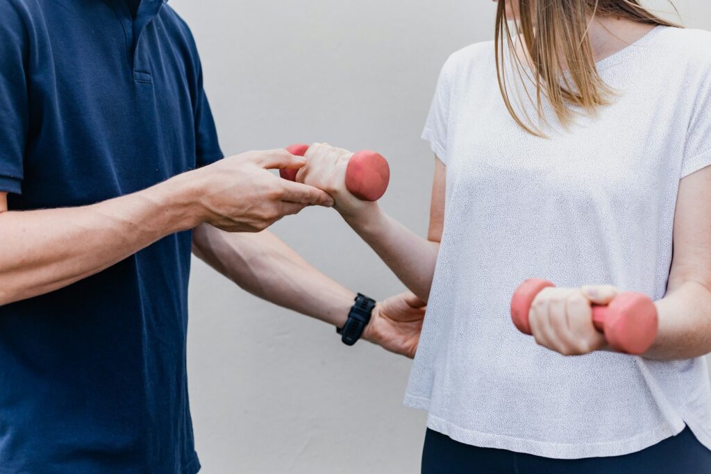 Physiotherapist guiding a patient through strengthening exercises